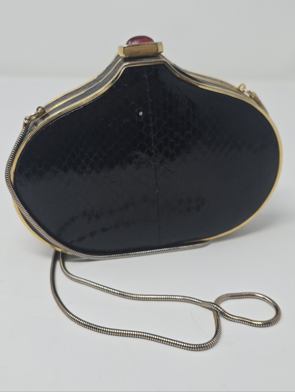 Vintage 1980s Black Faux Snakeskin Hard Shell Clutch Bag with Ruby-Tone Cabochon